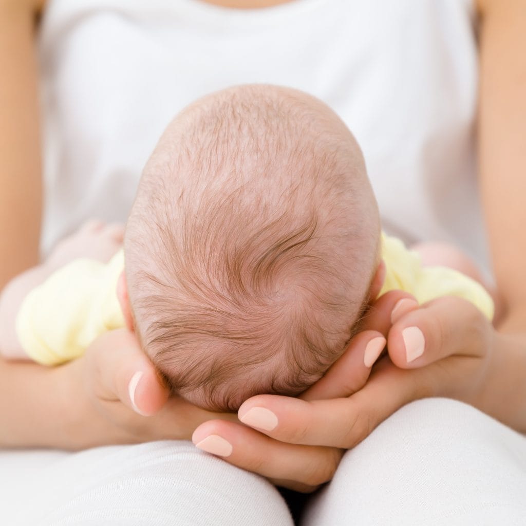 woman holding newborn baby