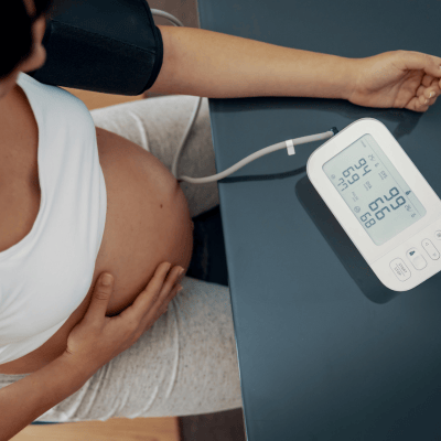 pregnant woman checking blood pressure